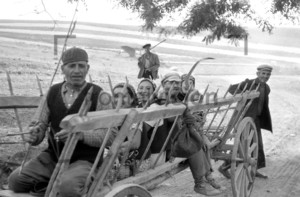 Rural people sitting on a carriage Historic image from 1965